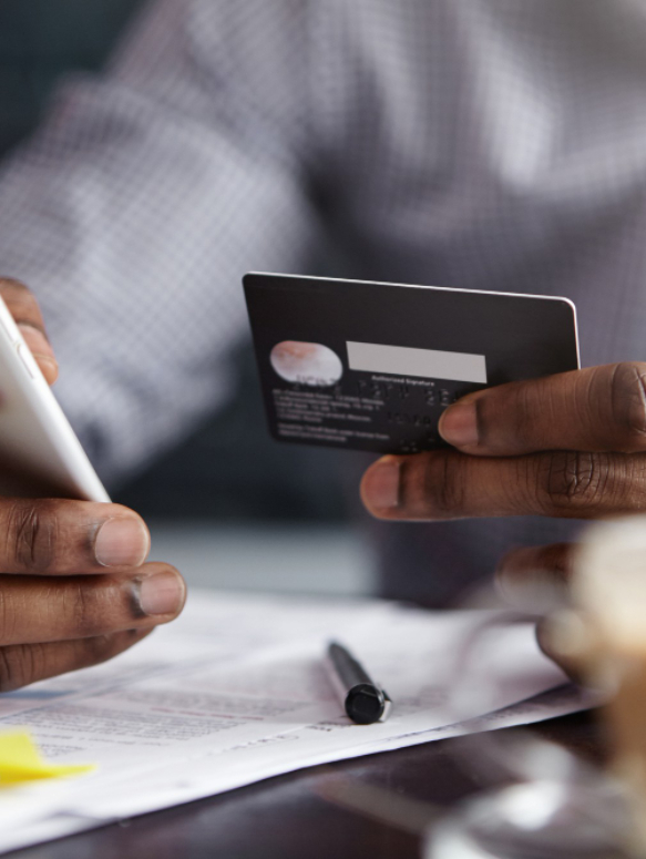 cropped-shot-african-american-businessman-paying-with-credit-card-online